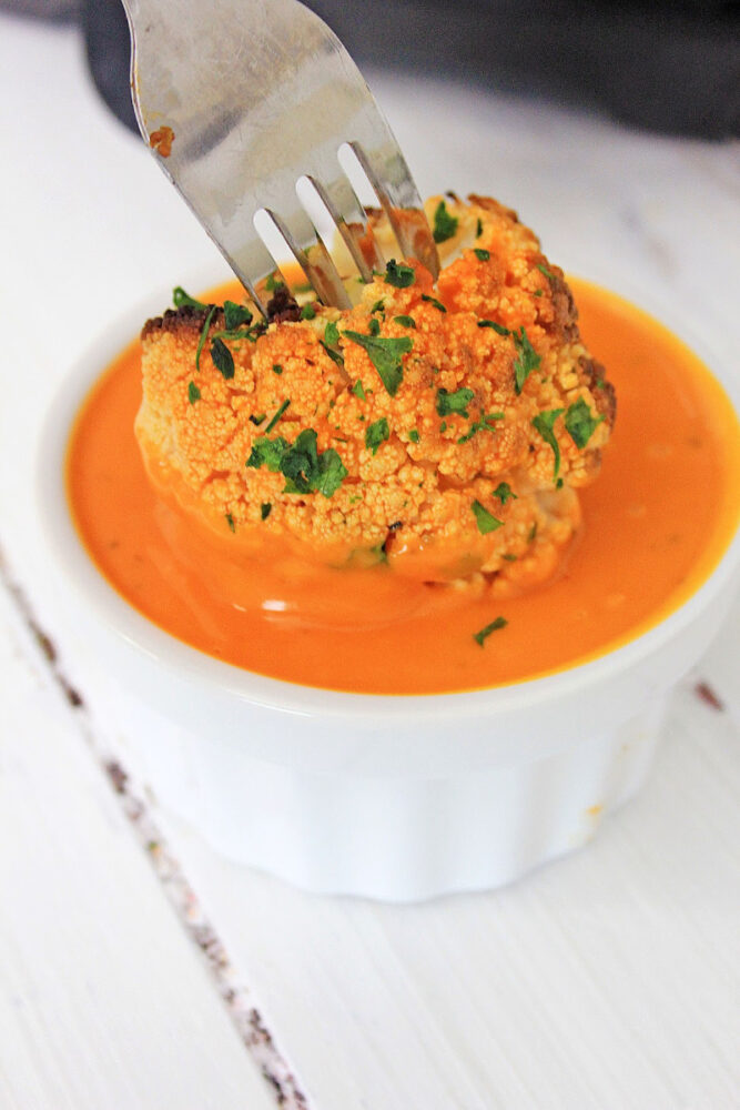 Air Fryer Buffalo Cauliflower on a fork