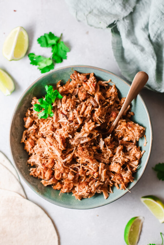 Instant Pot Mexican Carnitas in bowl with a fork