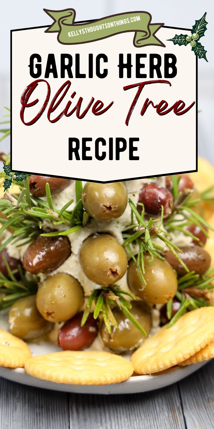 Assorted olives and rosemary sprigs stacked in a tree shape on cheese, surrounded by crackers. This Garlic Herb Olive Tree recipe brings a festive touch to your table, perfect for any occasion.