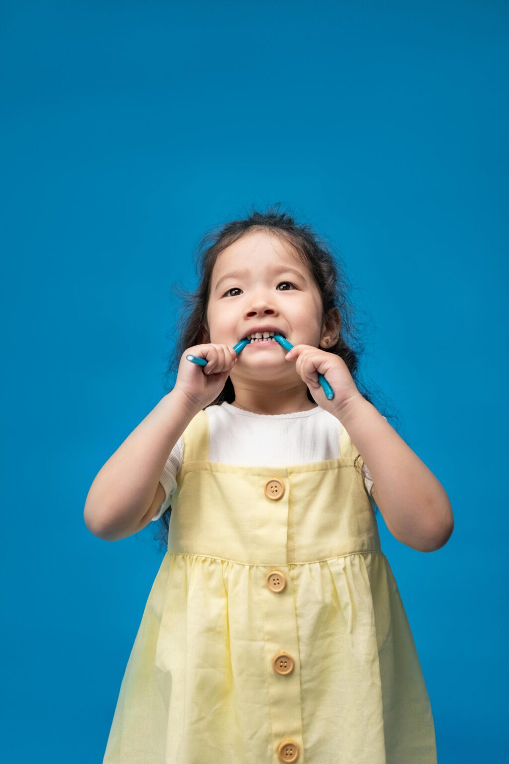 girl eating sugary candy