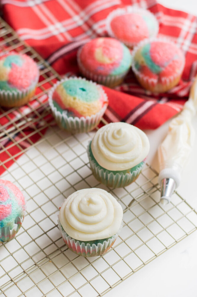 Tie Dye Patriotic Cupcakes being frosted