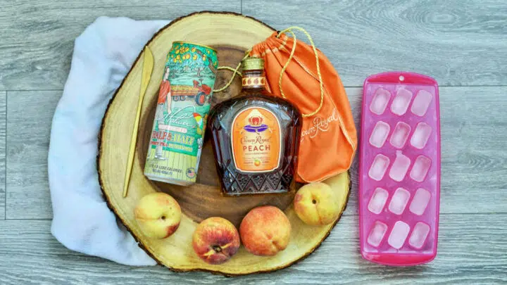 peaches and crown royal on a table