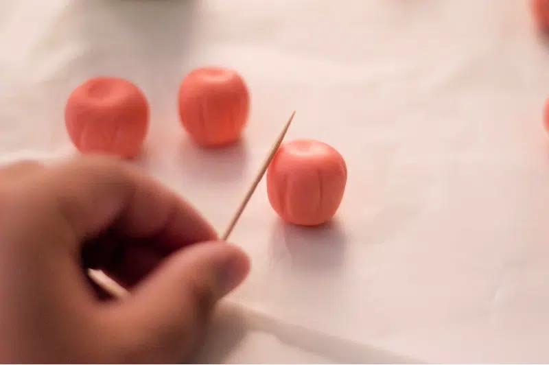 Pumpkin Cupcakes with a toothpick