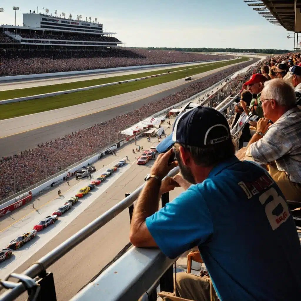 Crowd watches from a grandstand overlooking a racetrack in South Carolina, where cars are lined up, preparing for a race. The scene is vibrant with spectators and racing activity on a clear day, making it one of the exciting things to do in South Carolina.