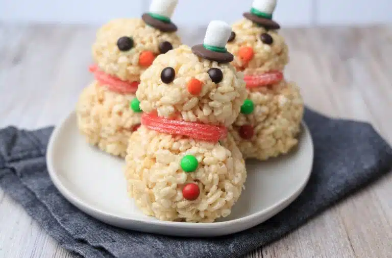 Snowman Rice Krispy Treats on a white plate